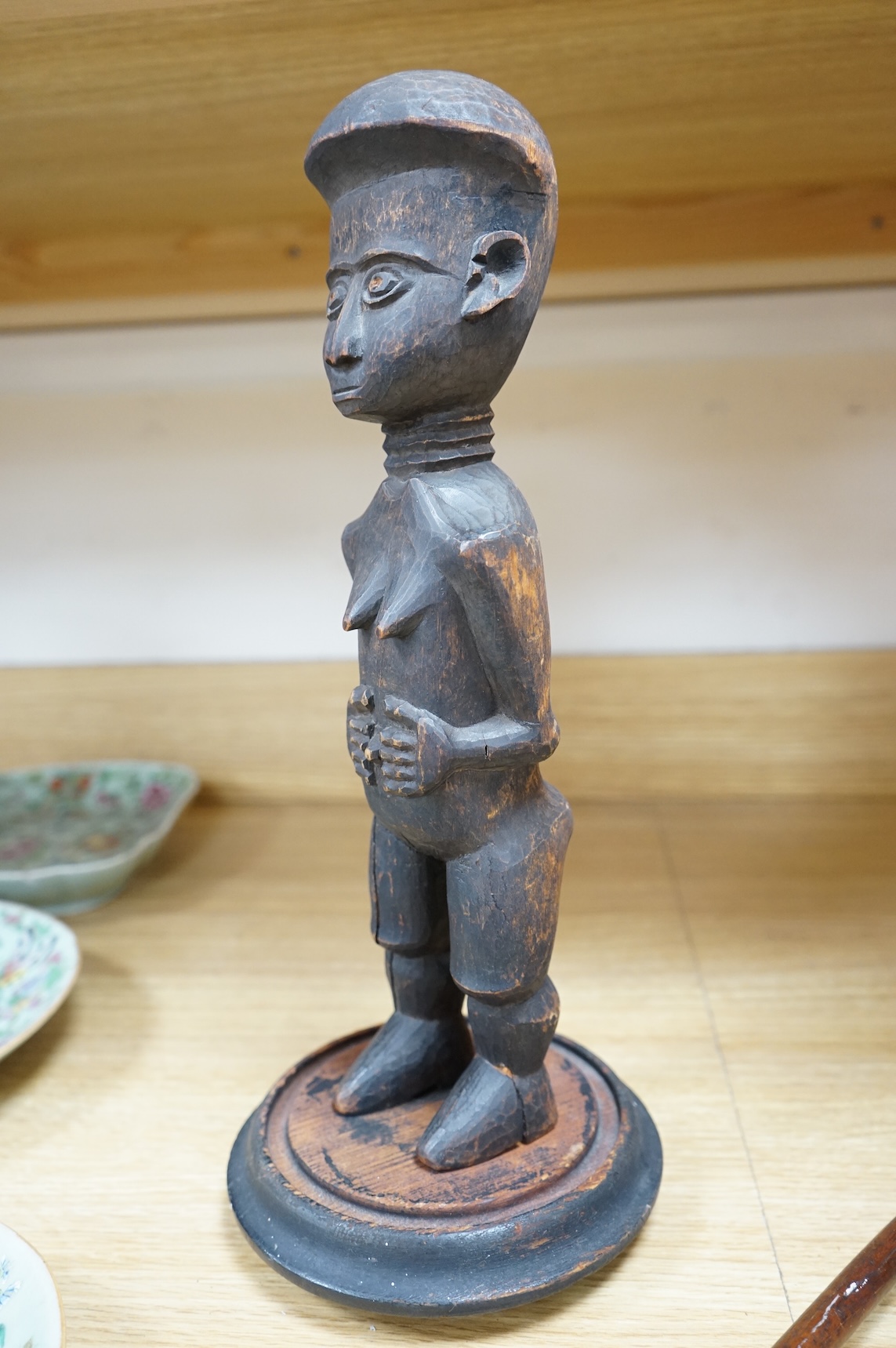 A Fang peoples female reliquary figure, Equatorial Guinea, Provenance - vendors grandfather in law brought back from Africa when working in the Gold Coast late 19th/early 20th century, on stand, 36cm high not including s